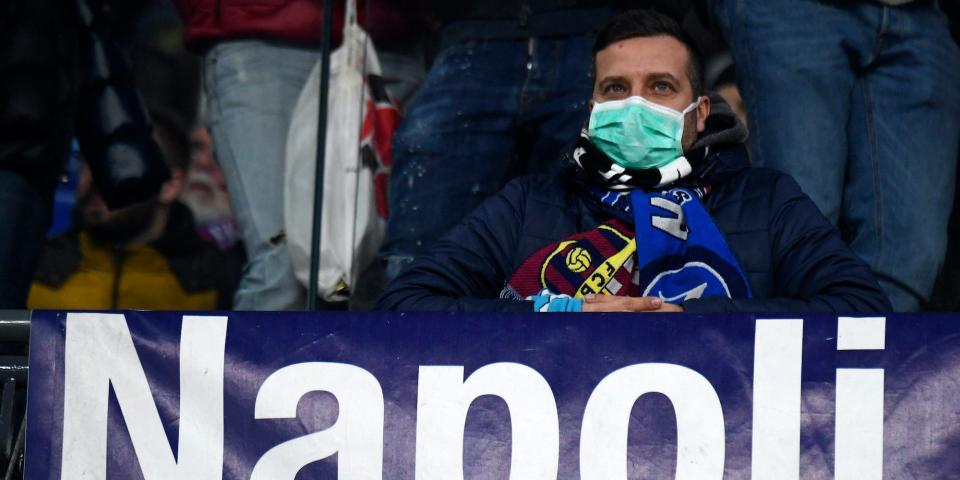 NAPLES, CAMPANIA, ITALY - 2020/02/25: Fan wearing masks for fear of coronavirus infection (COVID-19) at the San Paolo Stadium in Naples, during the football match UEFA Champions League, SSC Napoli vs FC Barcelona. (Photo by Salvatore Laporta/KONTROLAB/LightRocket via Getty Images)