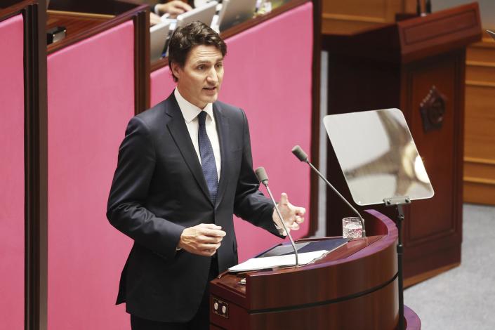 Canadian Prime Minister Justin Trudeau, bottom, delivers a speech at the National Assembly in Seoul, South Korea, Wednesday, May 17, 2023. (Korea Pool/Yonhap via AP)