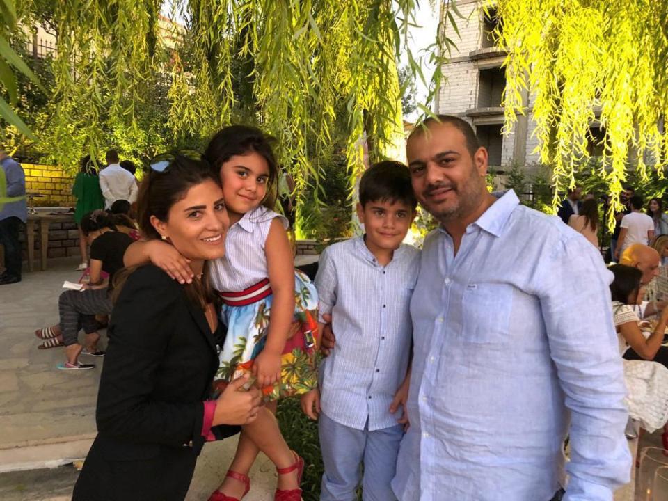 This Aug. 19, 2019 photo photo provided by Soha Saade,, shows Soha and her husband Jihad with their children Gemma and Karl, in Miziara, north of Lebanon. Jihad died in his wife's hands while staying with their sick six-year-old daughter at a hospital in a massive explosion that devastated Beirut Tuesday, Aug. 4, 2020. (Soha Saade via AP)