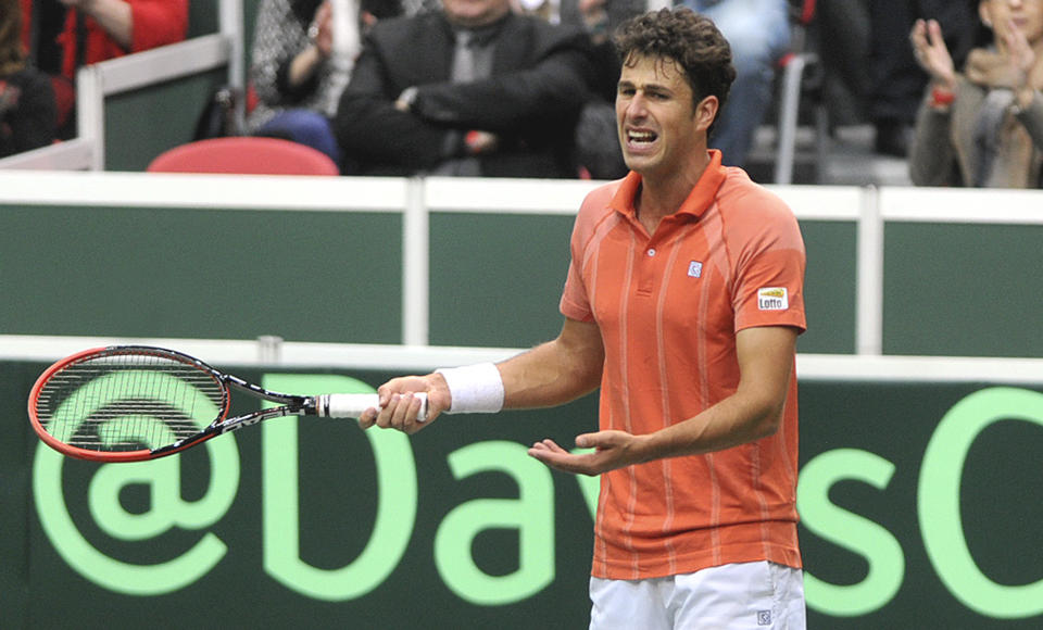 Robin Haase from the Netherlands grimaces during his opening single of the tennis Davis Cup first round match with Radek Stepanek from the Czech Republic in Ostrava, Friday, Jan. 31, 2014. (AP Photo,CTK/Jaroslav Ozana) SLOVAKIA OUT