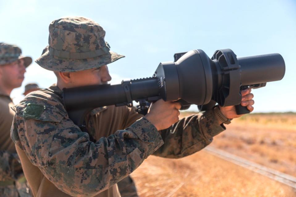 A Marine aims a NightFighter X hand-held counter-drone jammer while training in Australia. This gives a good sense of the bulky nature of existing man-portable jammer designs. <em>USMC</em> Cpl. Migel Reynosa