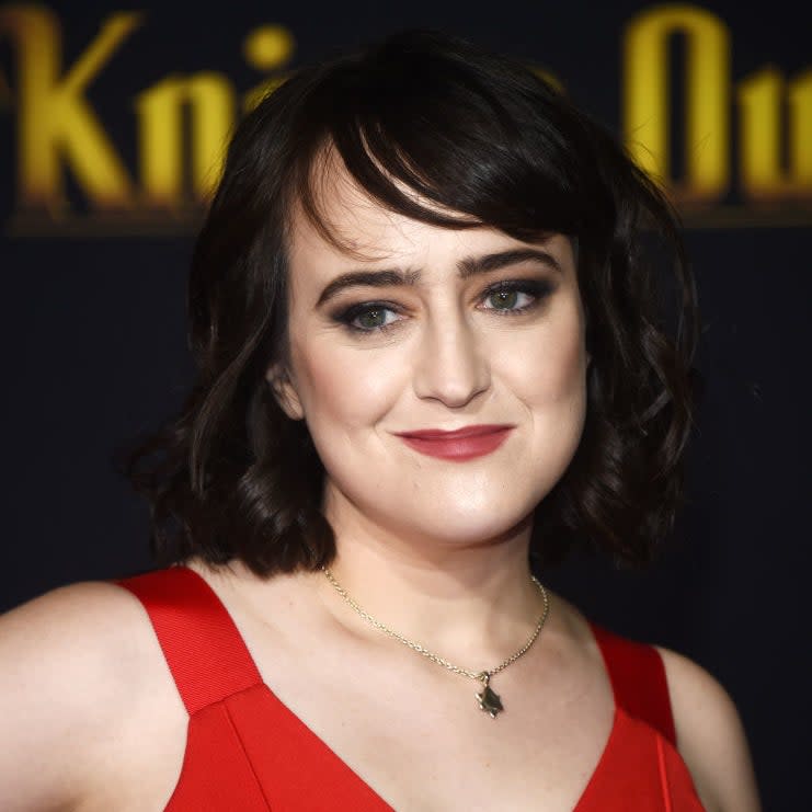 Mara Wilson wearing a red sleeveless dress with a V-neckline at a 'Knives Out' premiere