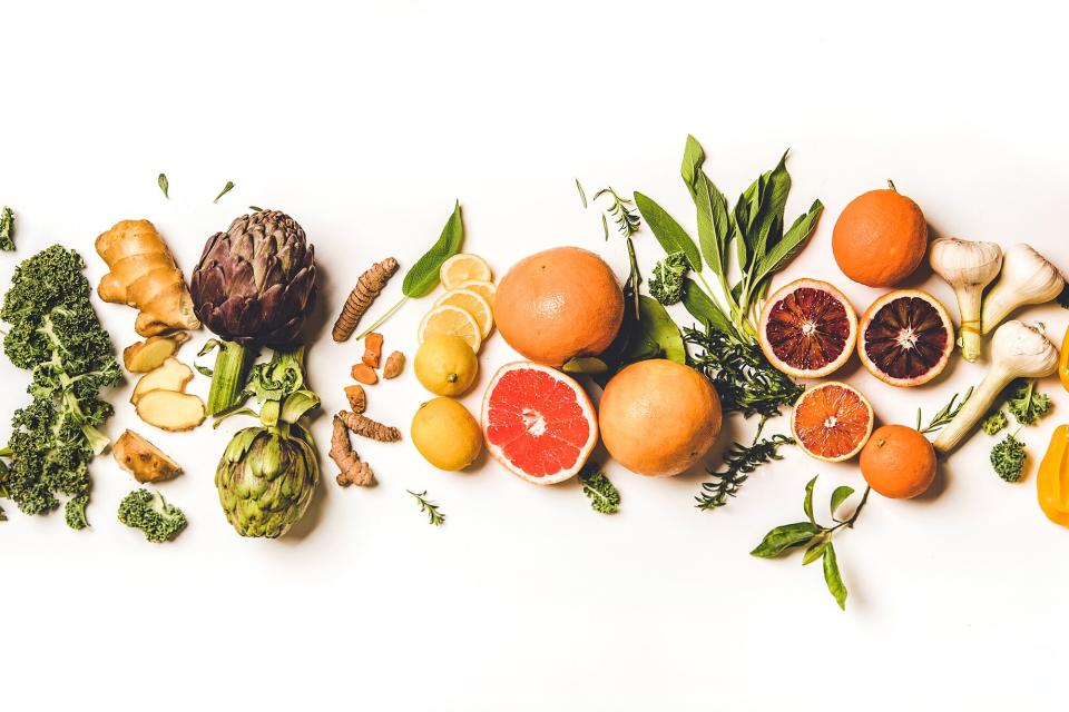 Variety of immunity boosting healthy foods over white background