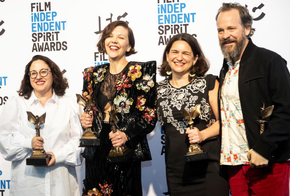 Osnat Handelsman Keren,  director Maggie Gyllenhaal, Talia Kleinhendler and Peter Sarsgaard  pose in the photo room after winning the Best Picture award for The Lost Daughter. 