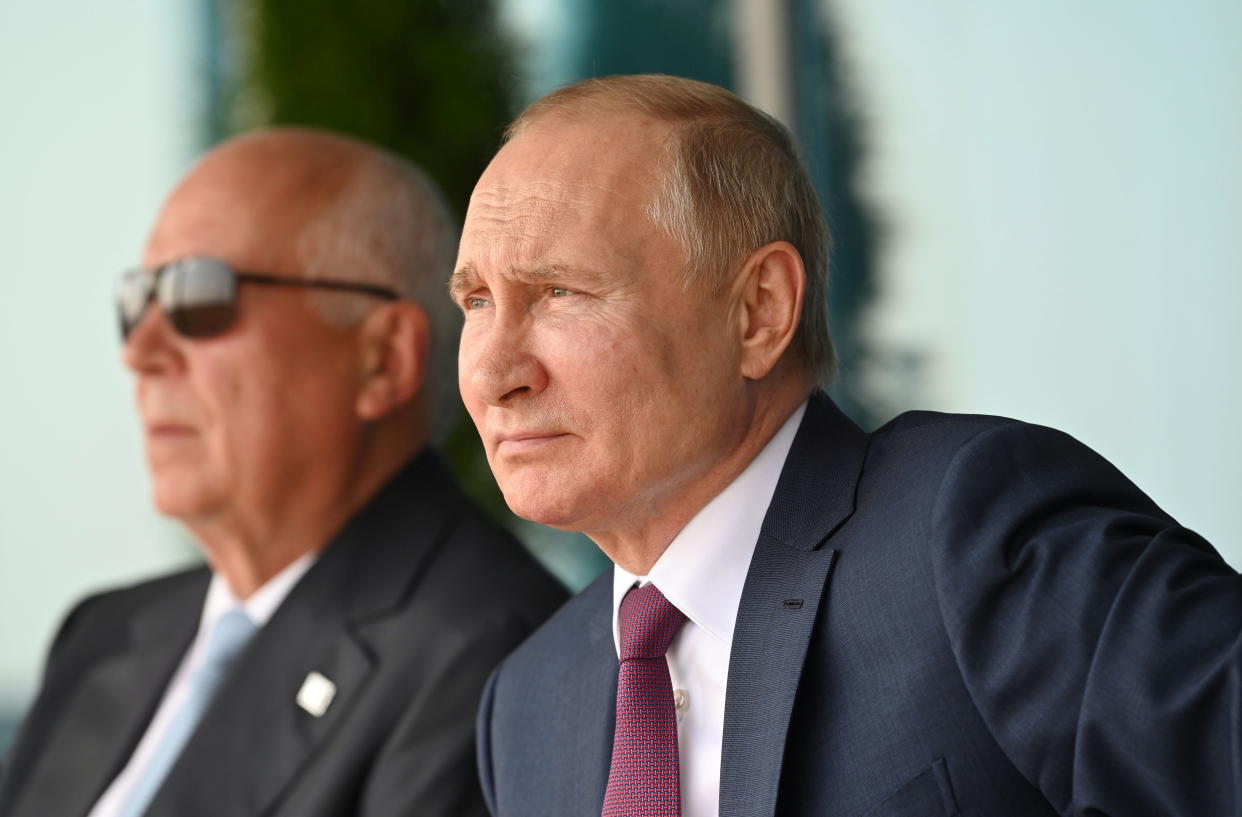 Russian President Vladimir Putin and Head of Rostec state conglomerate Sergei Chemezov attend an opening of the MAKS 2021 air show in Zhukovsky, outside Moscow, Russia, July 20, 2021.  Sputnik/Alexei Nikolskyi/Kremlin via REUTERS ATTENTION EDITORS - THIS IMAGE WAS PROVIDED BY A THIRD PARTY.