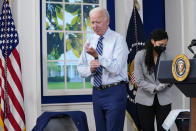 President Joe Biden buttons his sleeve after receiving a COVID-19 booster shot during an event in the South Court Auditorium on the White House campus, Monday, Sept. 27, 2021, in Washington. (AP Photo/Evan Vucci)