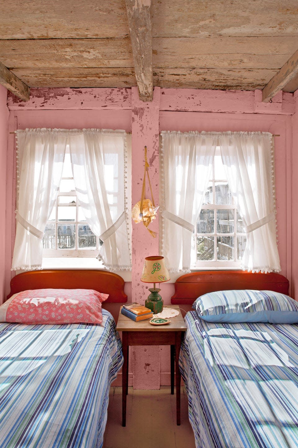 pink bedroom with two twin beds