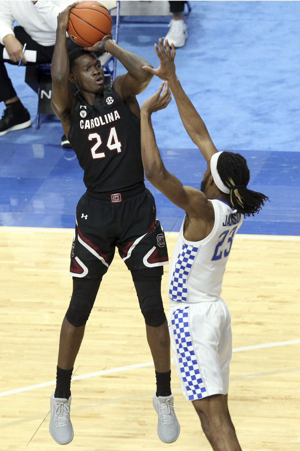 South Carolina's Keyshawn Bryant (24) shoots over Kentucky's Isaiah Jackson during the first half of an NCAA college basketball game in Lexington, Ky., Saturday, March 6, 2021. (AP Photo/James Crisp)