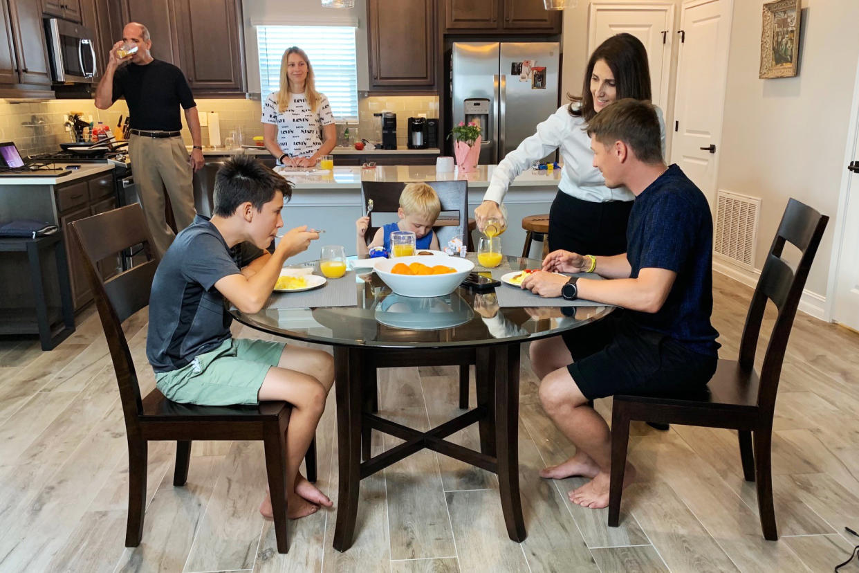 Roaya and Tony Tyson say their three-bedroom house was quiet before they welcomed Ukrainian refugees Yuliia Venhlinska and Serhii Donet and the couple's two children, Max, 11, and Mark, 3. (Mary Pflum)