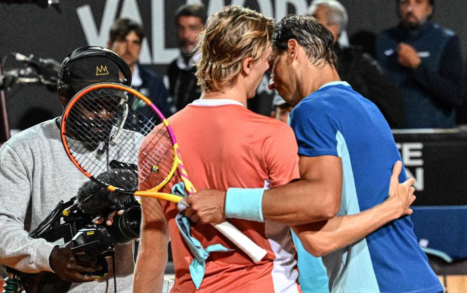 Canada's Denis Shapovalov (L) and Spain's Rafael Nadal greet after Shapovalov won their third round match at the ATP Rome Open tennis tournament on May 12, 2022 at Foro Italico in Rome - GETTY IMAGES