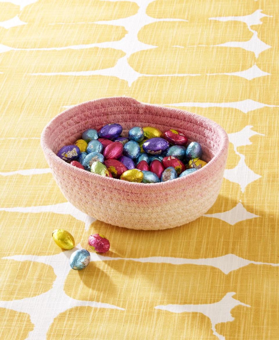 <p>A simple dyed cotton basket will add pops of color for storing candy or utensil on the Easter Table. </p><p><strong>To make:</strong> Dip the top quarter of a cotton basket in desired color of fabric dye. When dry, fill with moss and Easter eggs or candy.</p><p><a class="link " href="https://www.amazon.com/MINTWOOD-Design-Nesting-Baskets-Organizer/dp/B08JYFHPFG/ref=sr_1_6?tag=syn-yahoo-20&ascsubtag=%5Bartid%7C10050.g.1111%5Bsrc%7Cyahoo-us" rel="nofollow noopener" target="_blank" data-ylk="slk:SHOP BASKETS;elm:context_link;itc:0;sec:content-canvas">SHOP BASKETS</a></p>