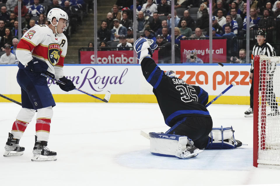 Florida Panthers forward Matthew Tkachuk looks on as Toronto Maple Leafs goaltender Ilya Samsonov (35) is scored on by Panthers forward Sam Reinhart during the third period of an NHL hockey game in Toronto on Wednesday, March 29, 2023. (Nathan Denette/The Canadian Press via AP)