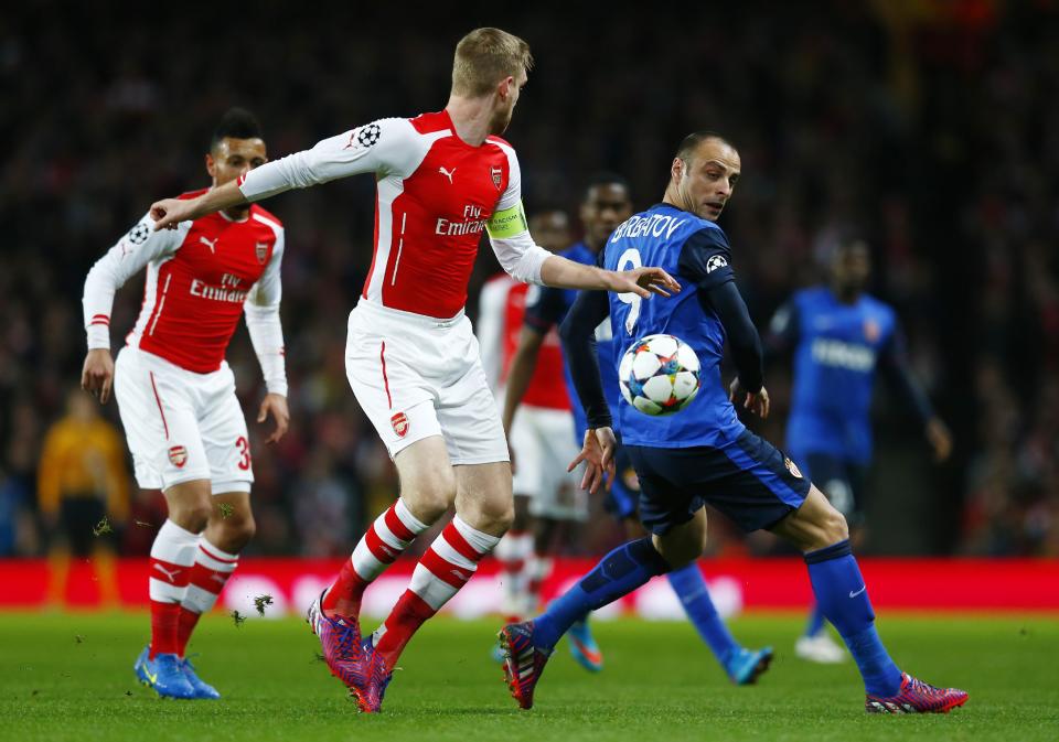 Football - Arsenal v AS Monaco - UEFA Champions League Second Round First Leg - Emirates Stadium, London, England - 25/2/15 Monaco's Dimitar Berbatov in action with Arsenal's Per Mertesacker Reuters / Eddie Keogh Livepic EDITORIAL USE ONLY.