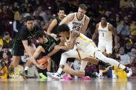 USC Upstate guard Miguel Ayesa, center left, and Minnesota guard Cam Christie, center right, battle for the ball during the second half of an NCAA college basketball game Saturday, Nov. 18, 2023, in Minneapolis. (AP Photo/Abbie Parr)