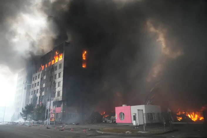 A building burns after shelling in Kyiv, Ukraine, Thursday, March 3, 2022. Russian forces have escalated their attacks on crowded cities in what Ukraine&#39;s leader called a blatant campaign of terror.