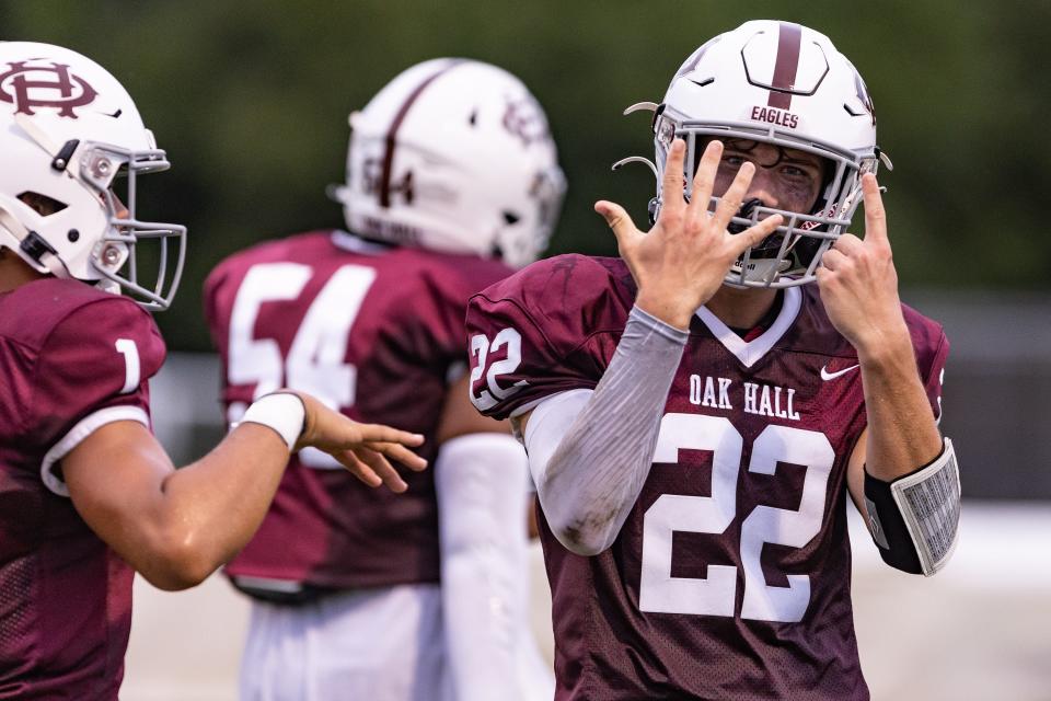 Running back Carter Dykes (22) celebrates a touchdown run for Oak Hall in Gainesville, on Friday, Sept. 2, 2022.