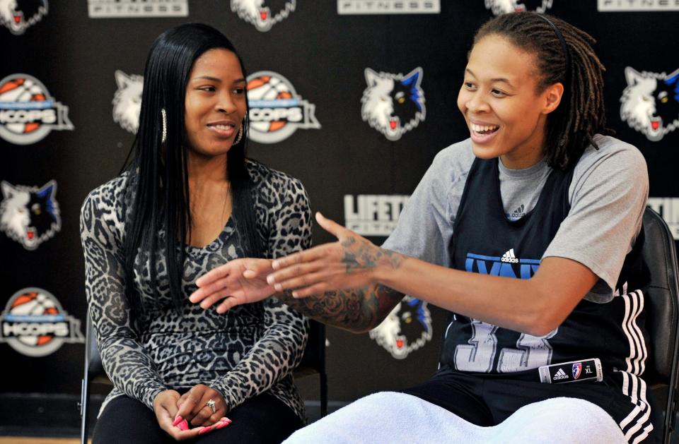 In this photo made Friday, Oct. 12, 2012, Minnesota Lynx WNBA basketball star and Olympic gold medalist Seimone Augustus talks about her relationship and engagement to LaTaya Varner, left, during an interview with The Associated Press in Minneapolis. With a wedding scheduled for May and a crucial vote in November that threatens to ban gay marriage in Minnesota, the intensely private Augustus is speaking out.