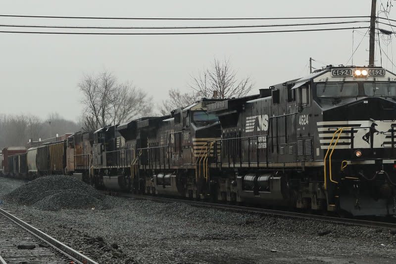A Norfolk Southern train passes through the center of the village of East Palestine, Ohio in Feb. 2023. On Monday, Norfolk Southern Alan Shaw defended his leadership of the company and the recent report critical of his management. File photo by Aaron Josefczyk/UPI