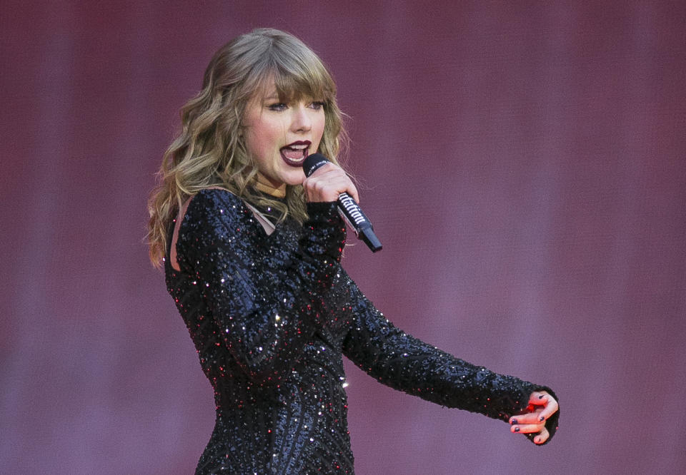 FILE - In this June 22, 2018, file photo, singer Taylor Swift performs on stage in concert at Wembley Stadium in London. A 27-year-old Austin, Texas, man has pleaded guilty to stalking and sending threatening letters and emails to pop star Taylor Swift's former record label. Federal prosecutors in Nashville, Tennessee, said in a news release the letters to Big Machine Label Group began in January 2018 with Eric Swarbrick asking the CEO to introduce him to Swift. (Photo by Joel C Ryan/Invision/AP, File)