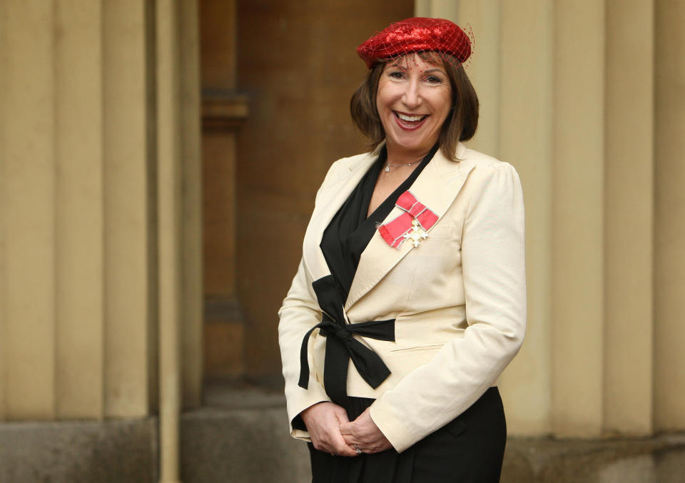 LONDON, ENGLAND - FEBRUARY 16: Leading TV writer Kay Mellor wears her OBE at Buckingham Palace following the investiture ceremony at Buckingham Palace on February 16, 2010 in London, England. Mellor, who was behind hit series such as Band Of Gold and Fat Friends, received her award from the Prince of Wales. (Photo by Dominic Lipinski - WPA Pool / Getty Images)