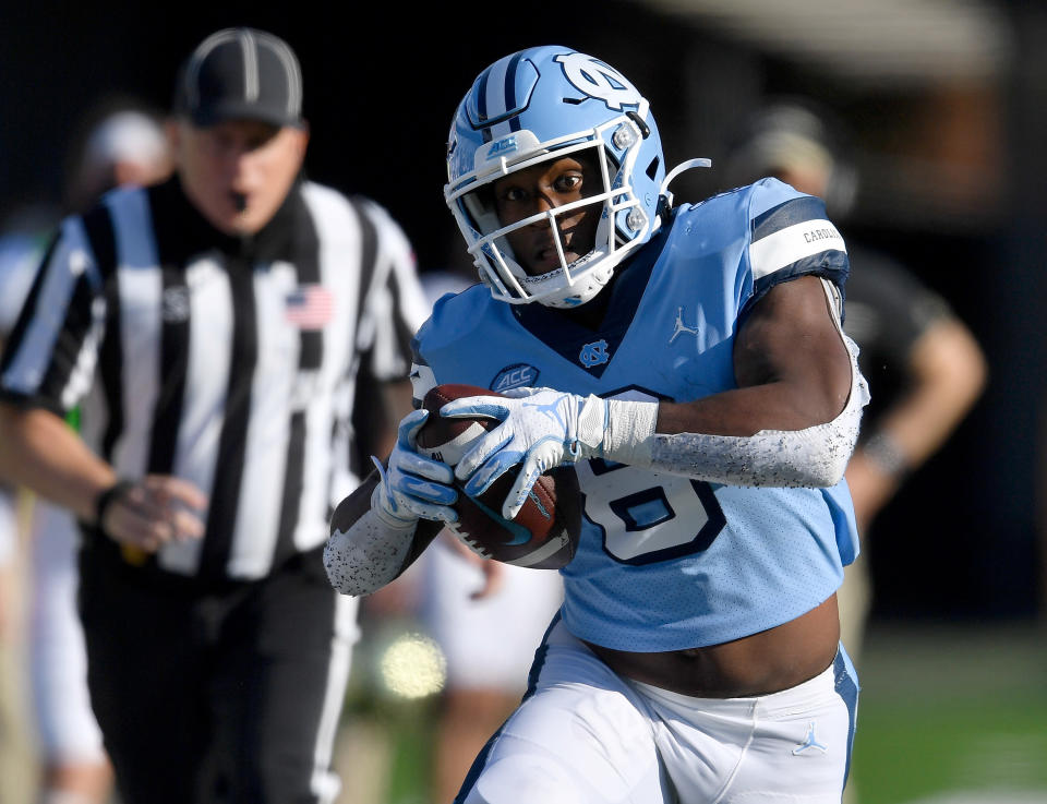 CHAPEL HILL, NORTH CAROLINA - NOVEMBER 14: Michael Carter #8 of the North Carolina Tar Heels runs against the Wake Forest Demon Deacons during their game at Kenan Stadium on November 14, 2020 in Chapel Hill, North Carolina. The Tar Heels won 59-53. (Photo by Grant Halverson/Getty Images)