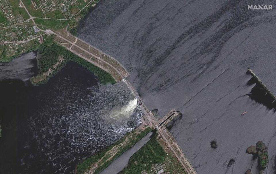 A stallite image of the damage to the Nova Kakhovka dam  (via REUTERS)