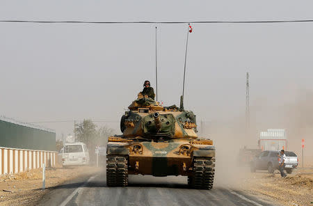 A Turkish army tank drives towards to the border in Karkamis on the Turkish-Syrian border in the southeastern Gaziantep province, Turkey, August 25, 2016. REUTERS/Umit Bektas