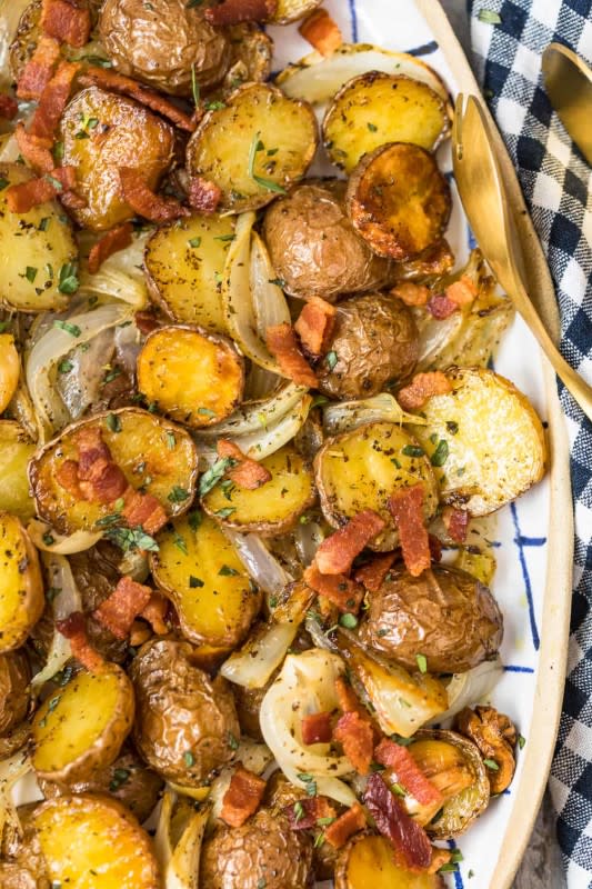 <p>The Cookie Rookie</p><p>Roasted red potatoes are cooked with bacon and onion for a side full of flavor.</p><p><strong>Get the recipe: <a href="https://www.thecookierookie.com/roasted-red-potatoes-with-bacon-and-onion/" rel="nofollow noopener" target="_blank" data-ylk="slk:Roasted Red Potatoes with Bacon and Onion;elm:context_link;itc:0;sec:content-canvas" class="link rapid-noclick-resp">Roasted Red Potatoes with Bacon and Onion</a></strong></p>