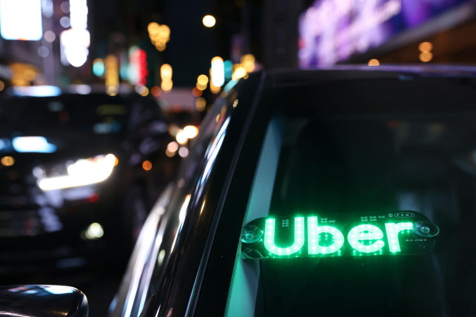The logo for Uber Technologies is seen on a vehicle in Manhattan, New York City, New York, U.S., November 17, 2021. REUTERS/Andrew Kelly