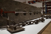 Tronco, or multiple foot stocks used to to constrain enslaved people, are seen at the Slavery exhibition Rijksmuseum in Amsterdam, Netherlands, Monday, May 17, 2021. The stark contrast between finery and brutality, wealth and inhumanity is a recurring pattern at the museum's unflinching new exhibition titled, simply, "Slavery", that examines the history of Dutch involvement in the international slave trade. (AP Photo/Peter Dejong)