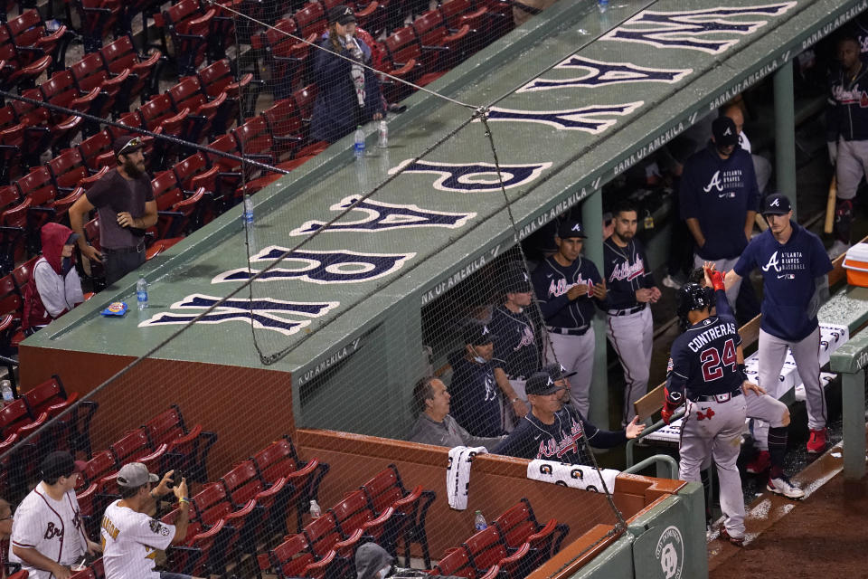 Atlanta Braves' William Contreras (24) is congratulated after his solo home run in the top of the ninth inning of a baseball game against the Boston Red Sox at Fenway Park, early Thursday, May 27, 2021, in Boston. (AP Photo/Charles Krupa)