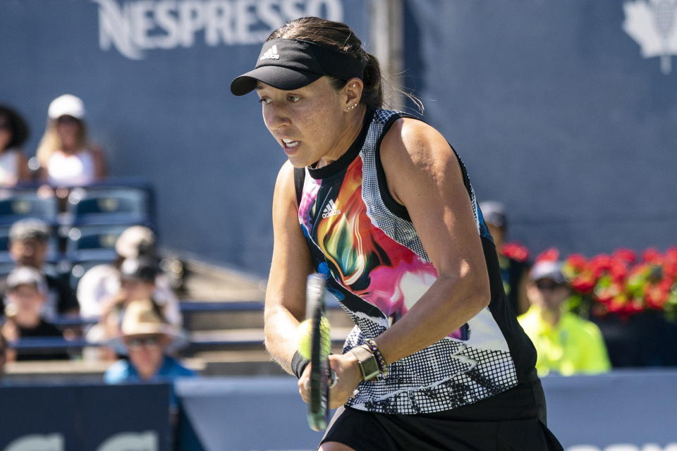 United States' Jessica Pegula hits a return to Romania's Simona Halep during the women's National Bank Open semifinal tennis match in Toronto, Saturday, Aug. 13, 2022. (Chris Young/The Canadian Press via AP)