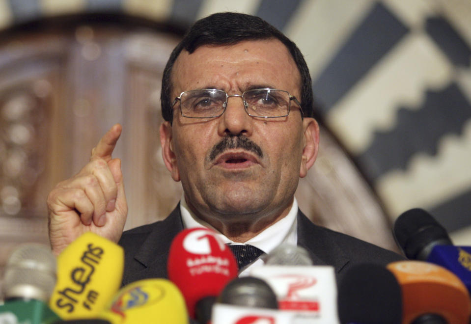 FILE - This is a Monday, July 29, 2013, file photo of Tunisian Prime Minister Ali Larayedh as he addresses the media in Tunis, Tunisia. Ali Larayedh of the moderate Islamist Ennahda Party had agreed to step down after lengthy negotiations with the opposition following a political crisis brought about by the assassination of a left-wing politician in July.The resignation of the Ennahda-led government in favor of a cabinet of technocrats has been seen as an implicit admission of the Islamists' failure to manage the transition following the 2011 overthrow of Tunisia's dictator. Tunisia's assembly is in the process of approving a new constitution, and elections for a new government will be held this year. "I hope the country will be a model for democratic transition," Larayedh told reporters Thursday Jan. 9, 2014 after presenting his resignation at the presidential palace. (AP Photo/Hassene Dridi, FILE)