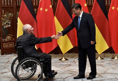 Chinese President Xi Jinping (R) shakes hand with German Finance Minister Wolfgang Schauble (L) before their meeting at the West Lake State House on the sidelines of the G20 Summit, in Hangzhou, Zhejiang province, China, September 5, 2016. REUTERS/Etienne Oliveau/Pool