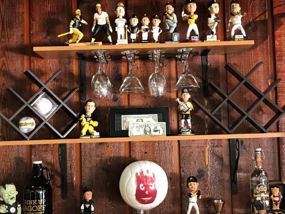 Bobbleheads on the walls at Game Time Sports Bar & Grill in Ambridge.