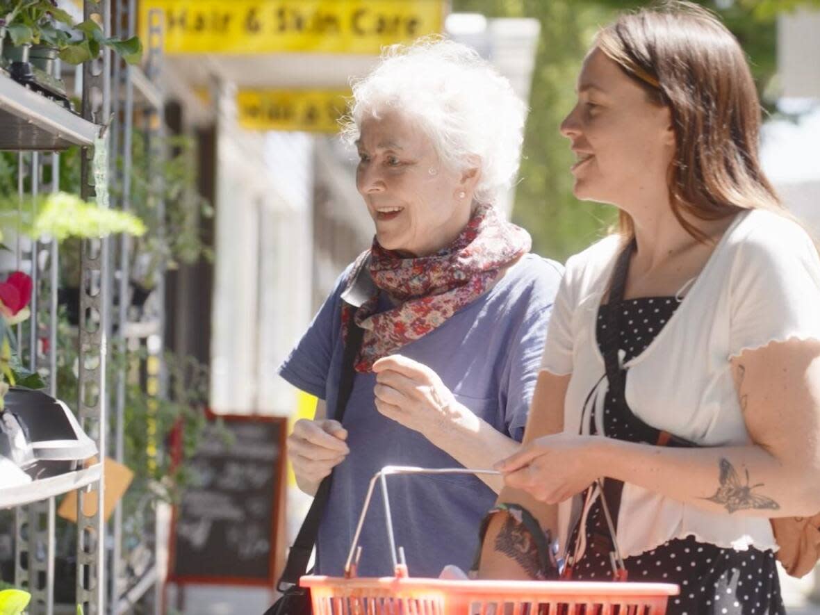 Hannah Tepoorten of Tuktu, right, is pictured with one of the service's regular customers, Annie McReynolds. Tuktu pairs British Columbians with care providers in their area to help out with things like errands and chores. (Submitted by Hannah Tepoorten - image credit)