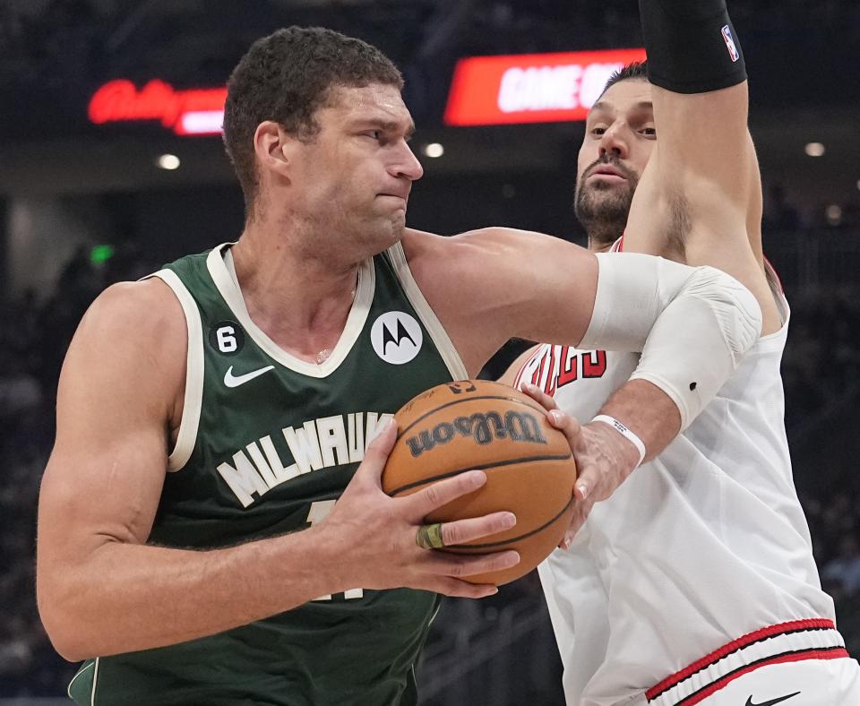 Bucks center Brook Lopez tries to muscle his way past the Bulls' Nikola Vucevic during the first half on Wednesday.


Mark Hoffman/Milwaukee Journal Sentinel