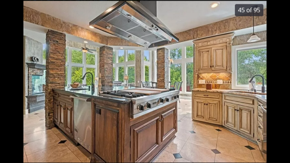 A look at one of the kitchens inside 425 NE St. Andrews Circle in Lee’s Summit. The windows give visitors a clear view of the backyard.