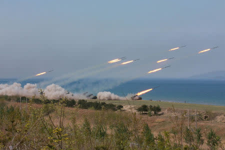 FILE PHOTO: A military drill marking the 85th anniversary of the establishment of the Korean People's Army (KPA) is seen in this handout photo by North Korea's Korean Central News Agency (KCNA) made available on April 26, 2017. CNA/Handout via REUTERS/File Photo