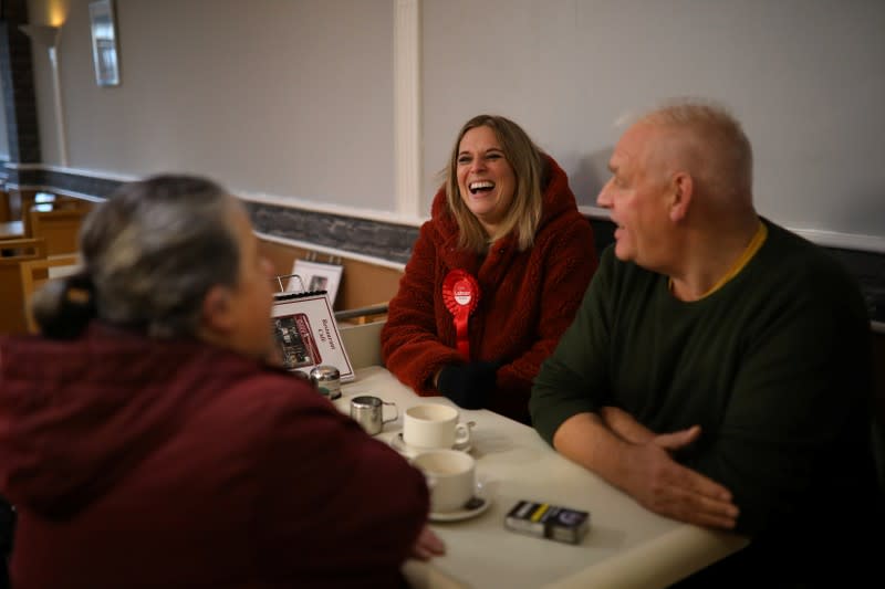 Smith, the Labour Party candidate for Crewe and Nantwich, laughs as she chats with locals in a cafe whilst campaigning in Crewe