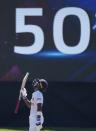 Sri Lankan batsman Pathum Nissanka looks skywards after scoring a half century against West Indies during the fourth day of their second test cricket match in Galle, Sri Lanka, Thursday, Dec. 2, 2021. (AP Photo/Eranga Jayawardena)