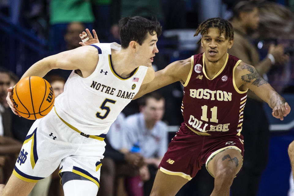 Notre Dame's Cormac Ryan (5) works against Boston College's Makai Ashton-Langford (11) during an NCAA college basketball game Saturday, Jan. 21, 2023 in South Bend, Ind. (AP Photo/Michael Caterina)