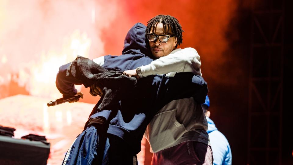 Lil Wayne and T.I. embrace publicly for the first time since T.I. criticized Wayne’s comments about the Black Lives Matter movement in 2016, a highlight from Dreamville Festival day two. - Credit: Greg Noire