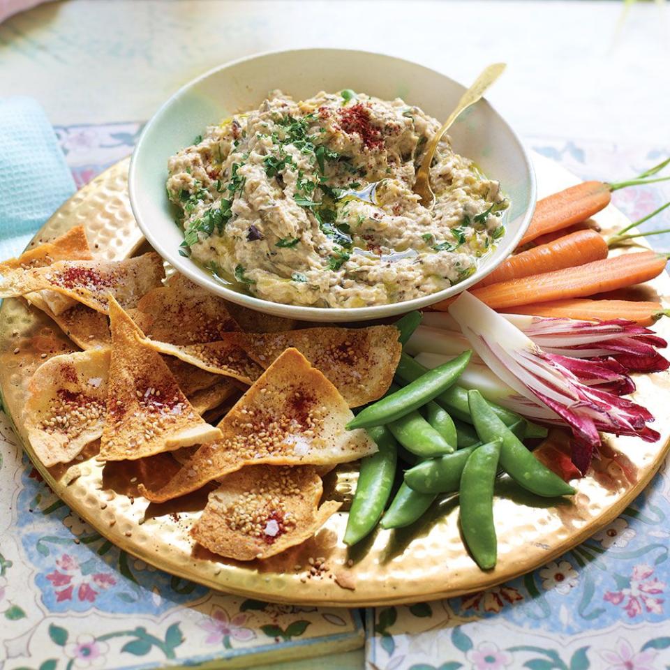 <p>This smoky aubergine dip is simple to make and incredibly moreish – it’s ideal for preparing ahead, too.</p><p><strong>Recipe: <a href="https://www.goodhousekeeping.com/uk/food/recipes/a570596/aubergine-dip-recipe/" rel="nofollow noopener" target="_blank" data-ylk="slk:Mutabal with Sesame Pitta Crisps;elm:context_link;itc:0;sec:content-canvas" class="link ">Mutabal with Sesame Pitta Crisps</a></strong></p>