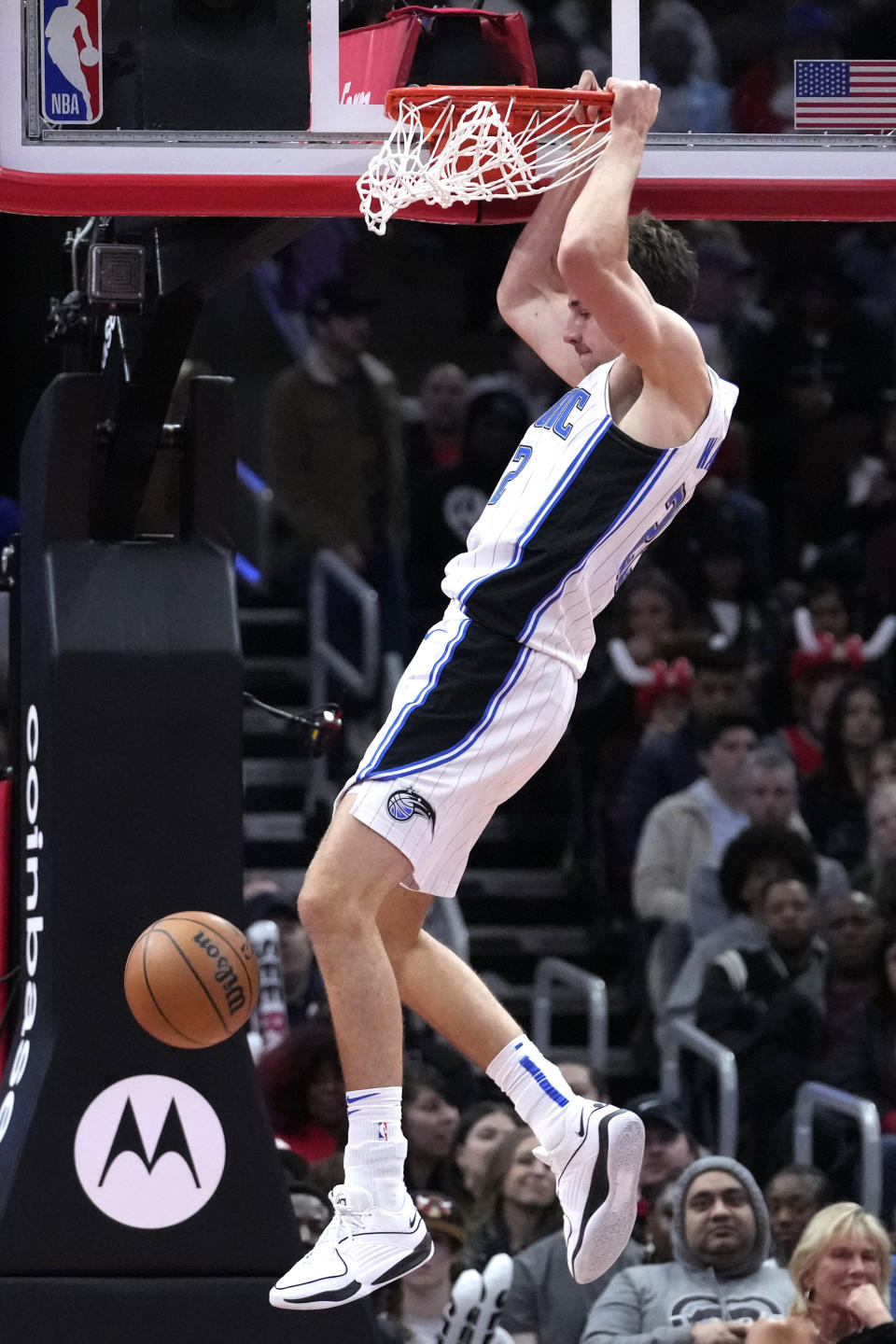 Orlando Magic forward Franz Wagner hangs from the rim after dunking during the second half of an NBA basketball game against the Chicago Bulls in Chicago, Friday, Nov. 17, 2023. (AP Photo/Nam Y. Huh)