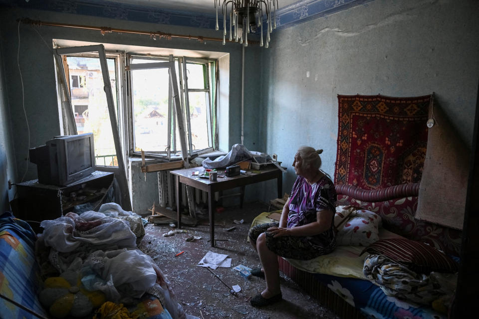 Lydia, 75, a local resident, sits in her destroyed flat, at an apartment building destroyed during a Russian missile strike, amid Russia's attack on Ukraine, in Pokrovsk, Donetsk region, Ukraine, August 8, 2023. / Credit: VIACHESLAV RATYNSKYI/REUTERS