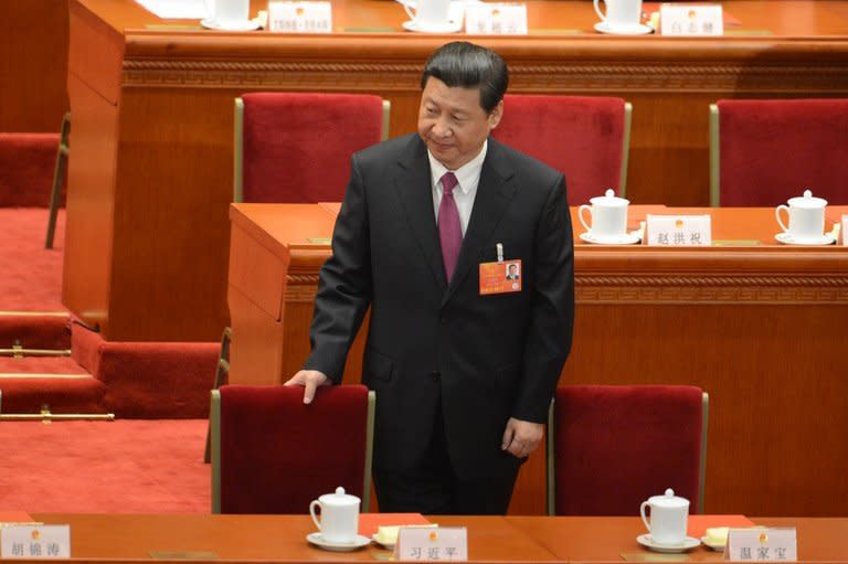 Newly-elected China's President, Xi Jinping, takes his seat at the closing session of the National People's Congress (NPC), at the Great Hall of the People in Beijing, on March 17, 2013. Xi said he would fight for a "great renaissance of the Chinese nation", in his first speech as head of state of the world's most populous country, without giving a detailed account of the phrase's meaning