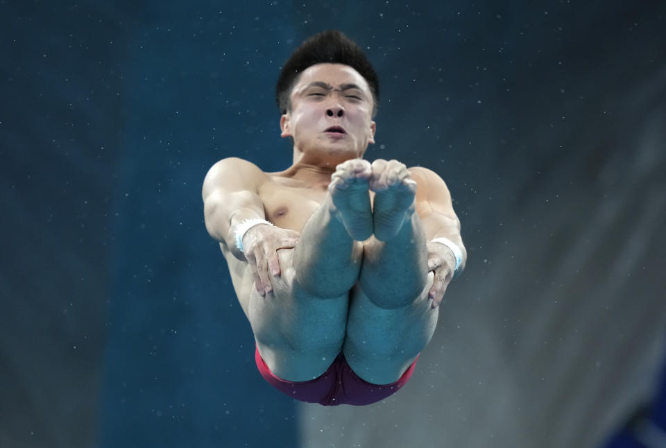 Cao Yuan of China competes in men's diving 10m platform final at the Tokyo Aquatics Centre at the 2020 Summer Olympics, Saturday, Aug. 7, 2021, in Tokyo, Japan. (AP Photo/Dmitri Lovetsky)