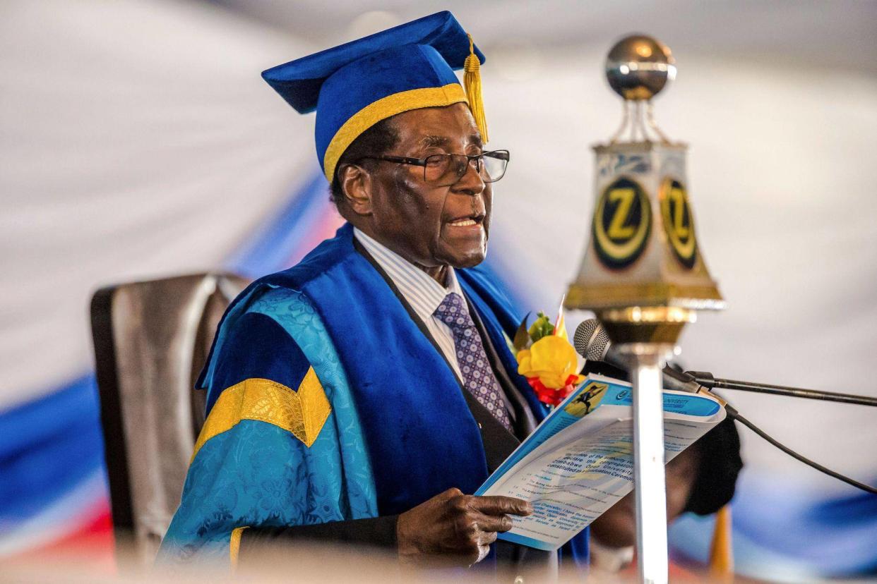 Zimbabwe's President Robert Mugabe delivers a speech during a graduation ceremony at the Zimbabwe Open University in Harare, where he presides as the Chancellor on November 17, 2017: JEKESAI NJIKIZANA/AFP/Getty Images