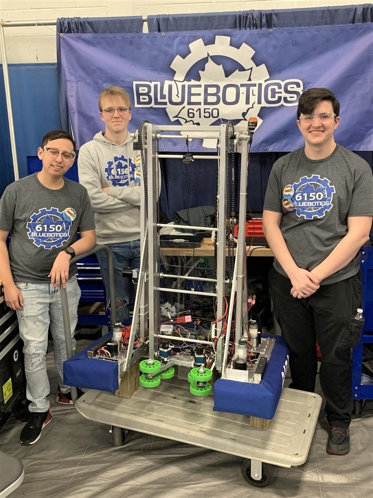 From left are Jesus Garcia, Sawyer Cranmore and Will Mackey, Adrian High School students who make up the Robotics Team 6150 Bluebotics. The team members are standing with their robot that placed third overall and in the top 10 of scoring March 11-12 at a district competition near Lansing.